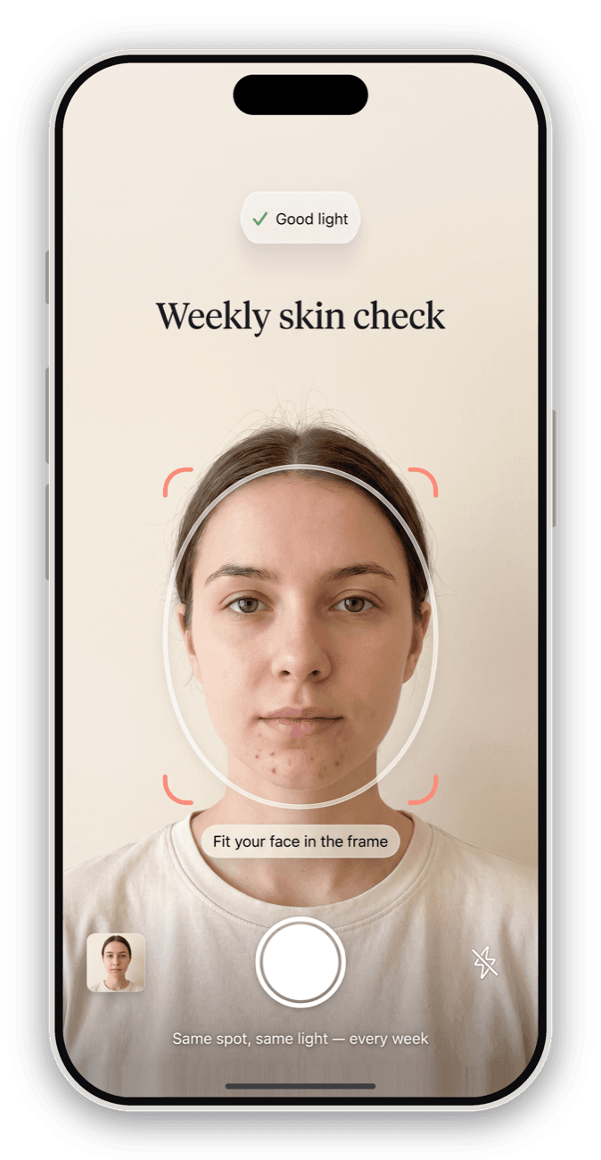 Weekly skin check camera screen with a face guide and lighting indicator.